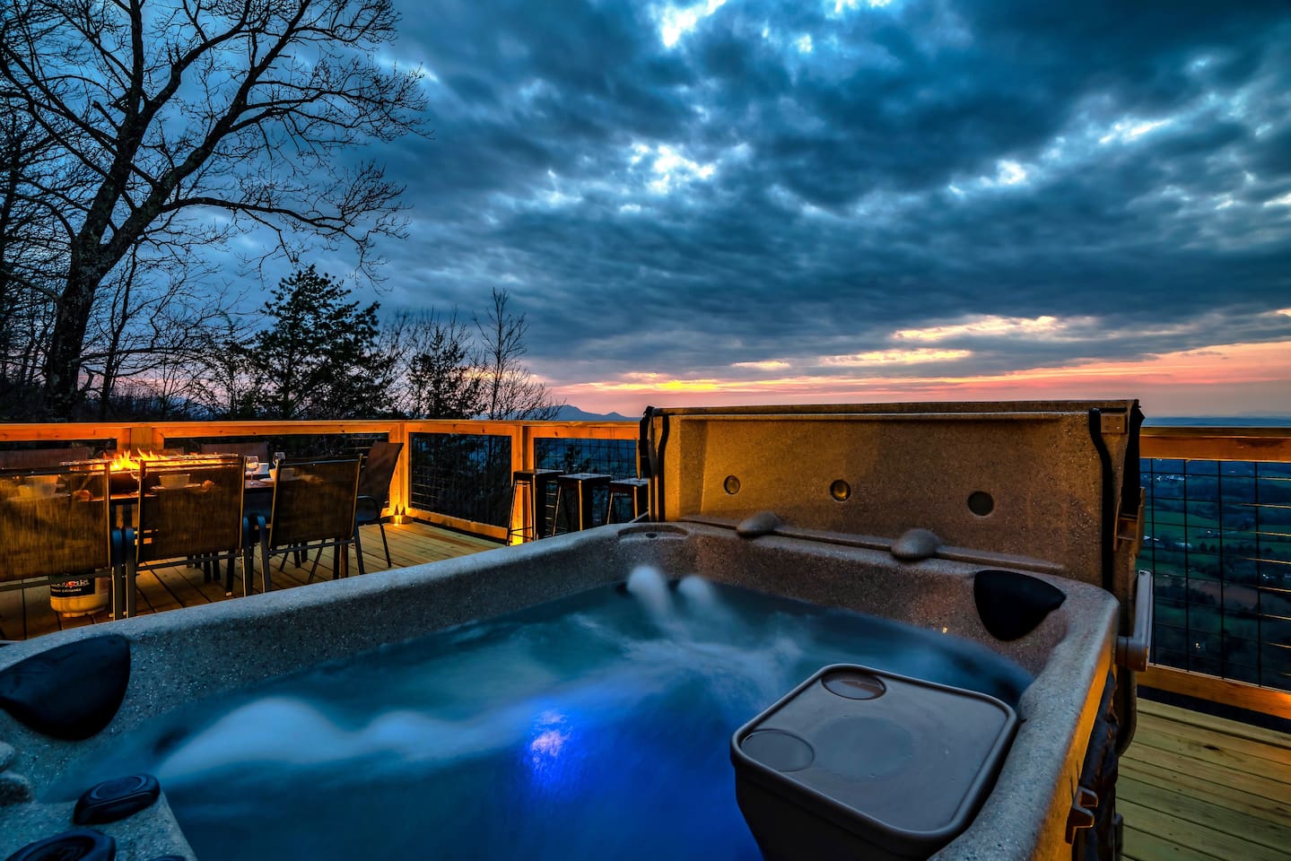 Unwind in the hot tub while golden hour paints the mountains in breathtaking color.