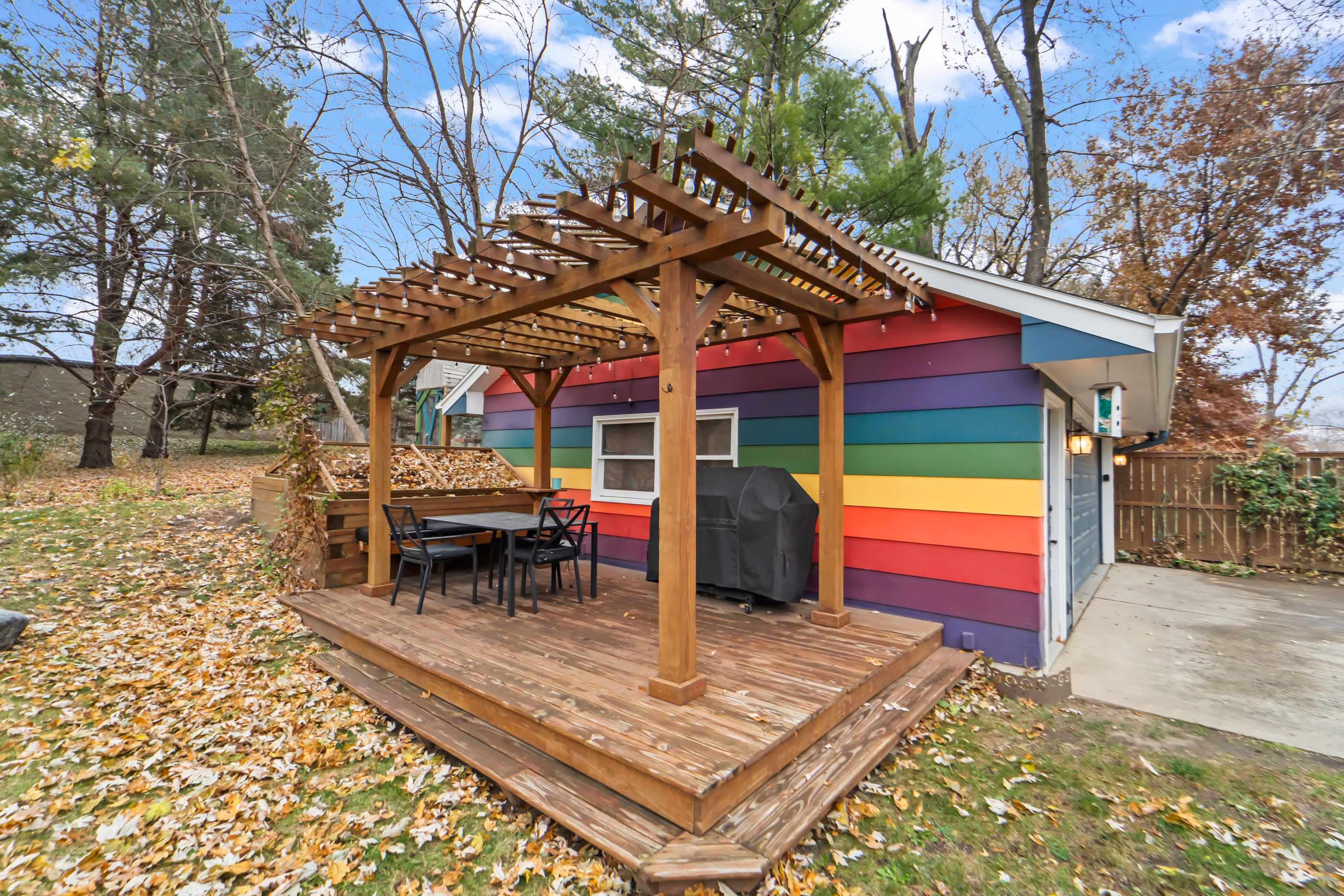 The backyard in the fall is a perfect time to have a cookout and jump in the leaves! 