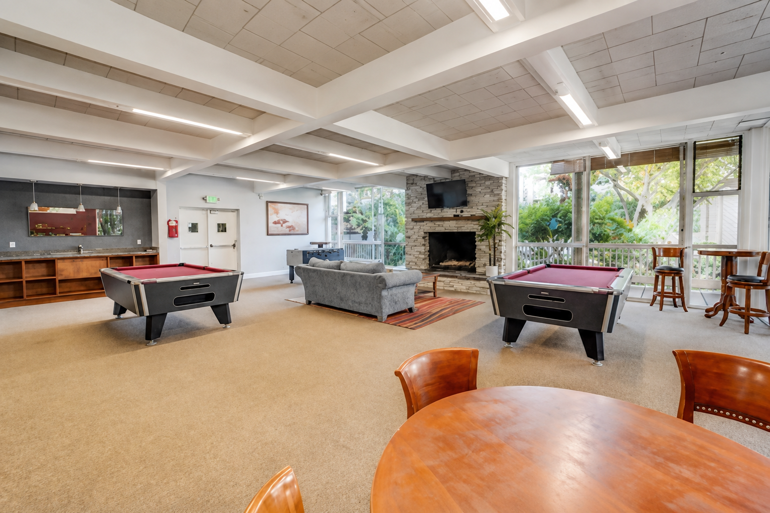 Game room with two pool tables