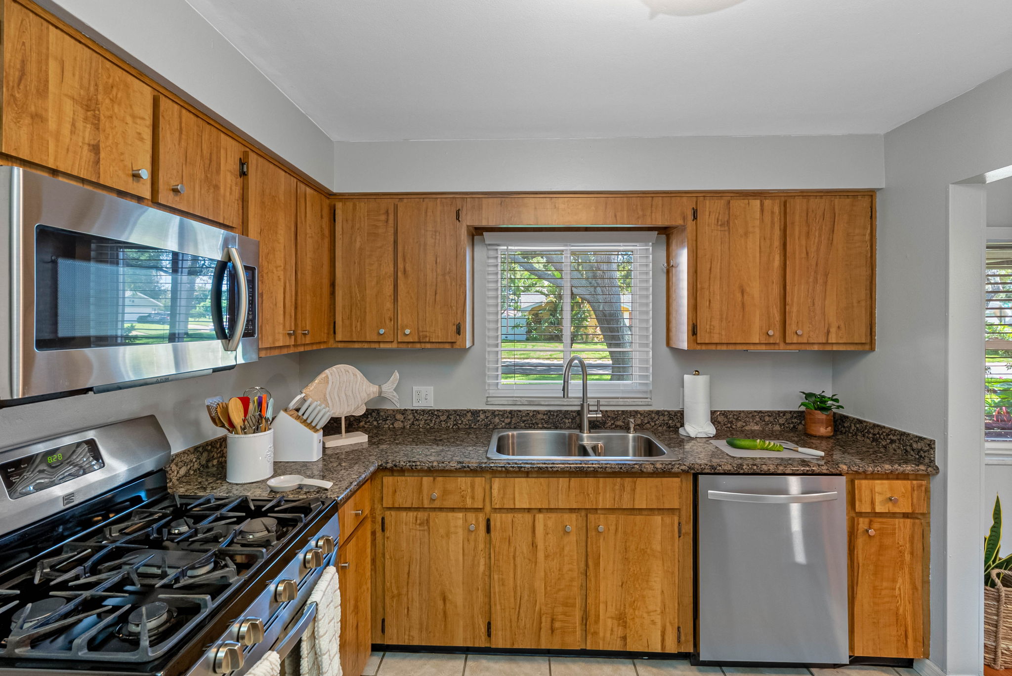 Brew your morning coffee and enjoy the sunrise with this serene window-side sink setup.