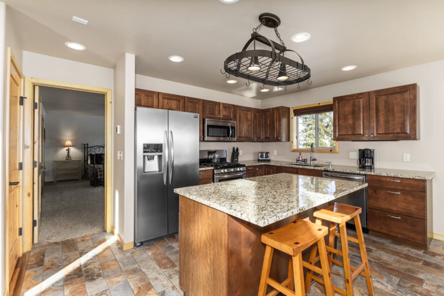 Kitchen – 4 burner gas stove | Breakfast bar for 2 