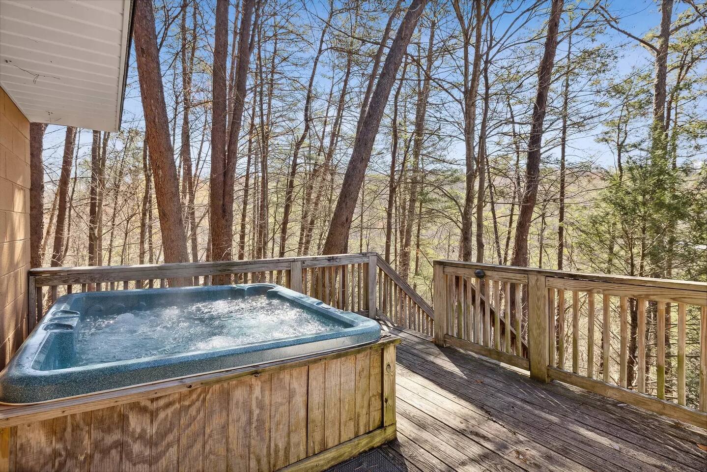 Hot tub on front deck of cabin