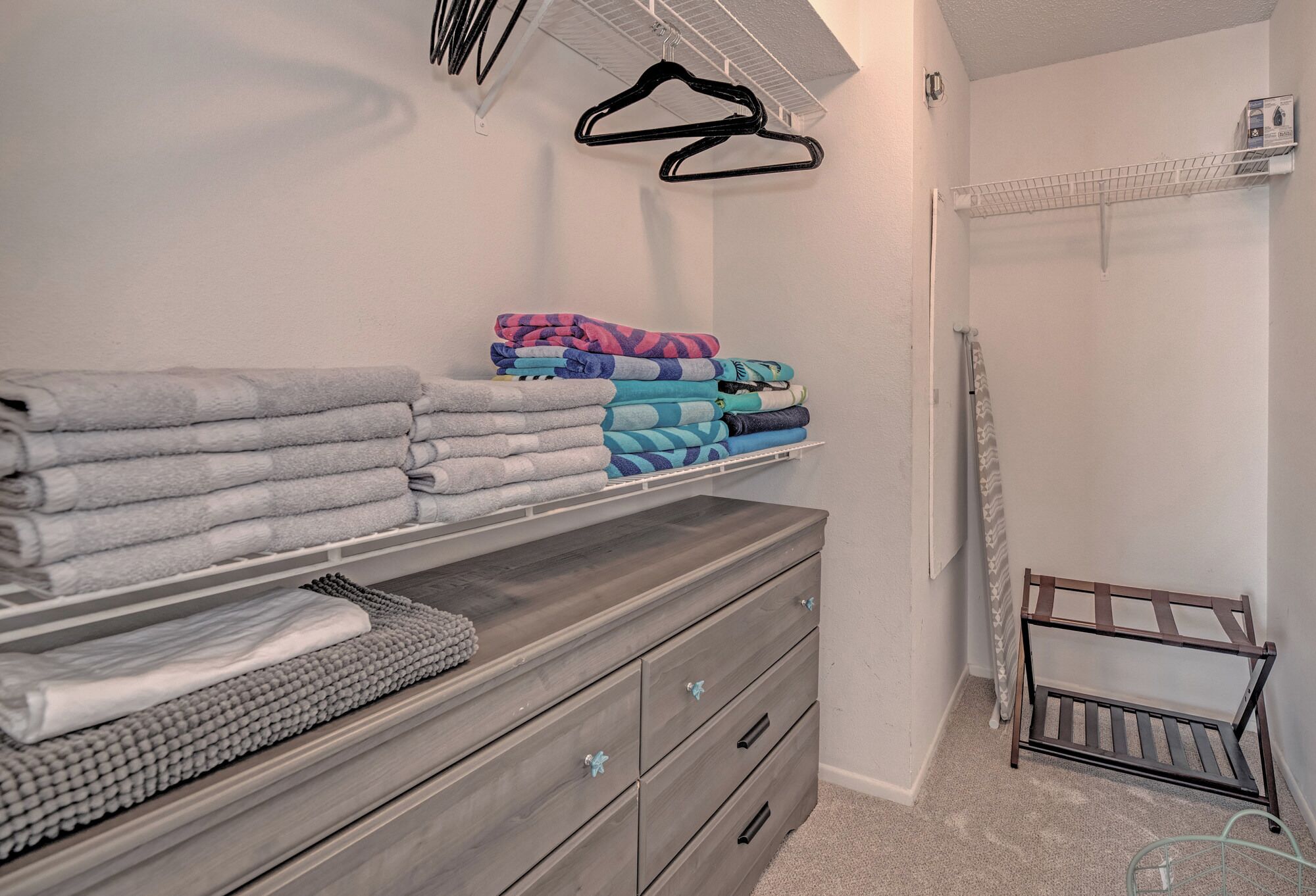 Walk in closet off the primary bedroom. This space fits a pack n' play perfectly! 