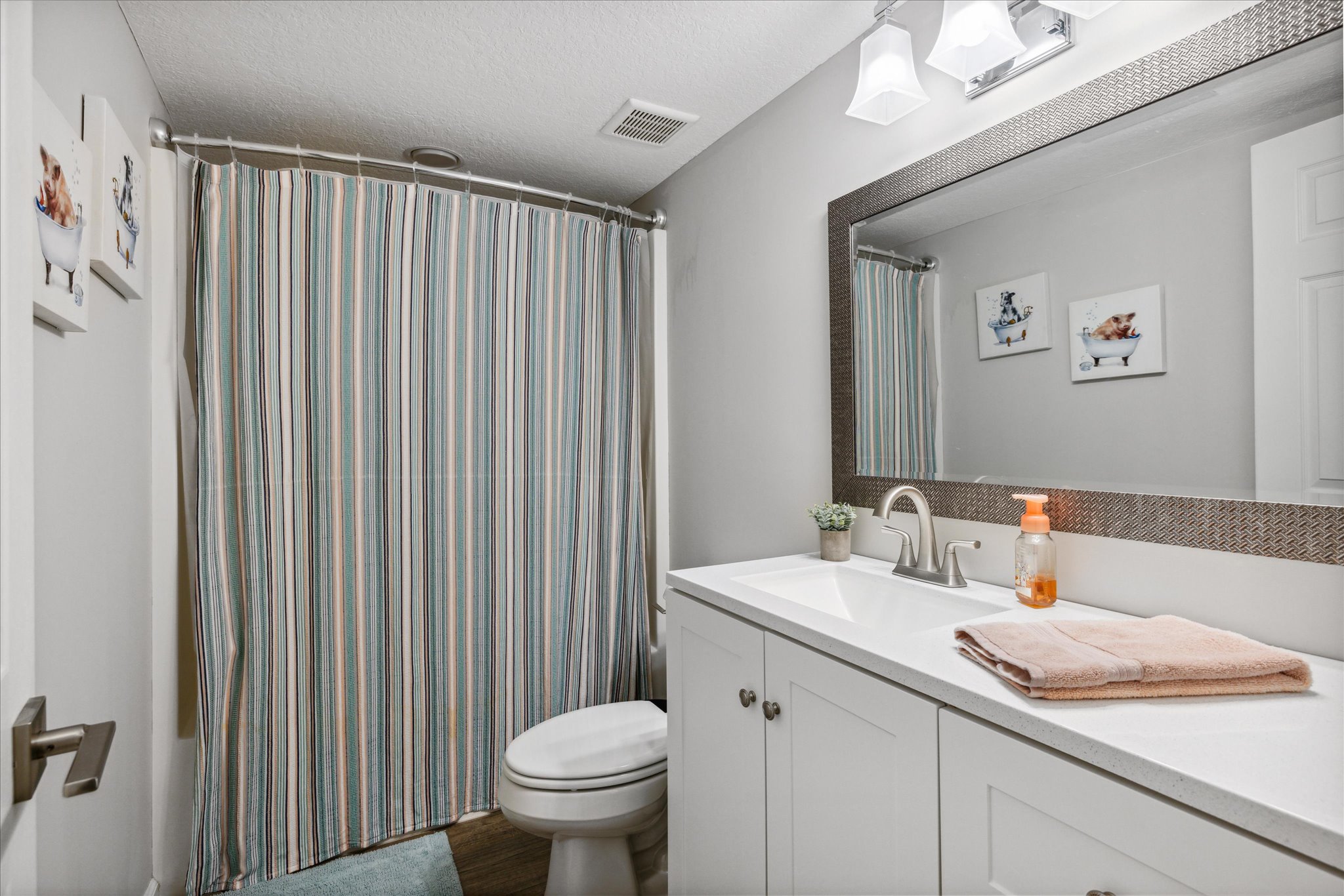 Shared bath across from laundry center
