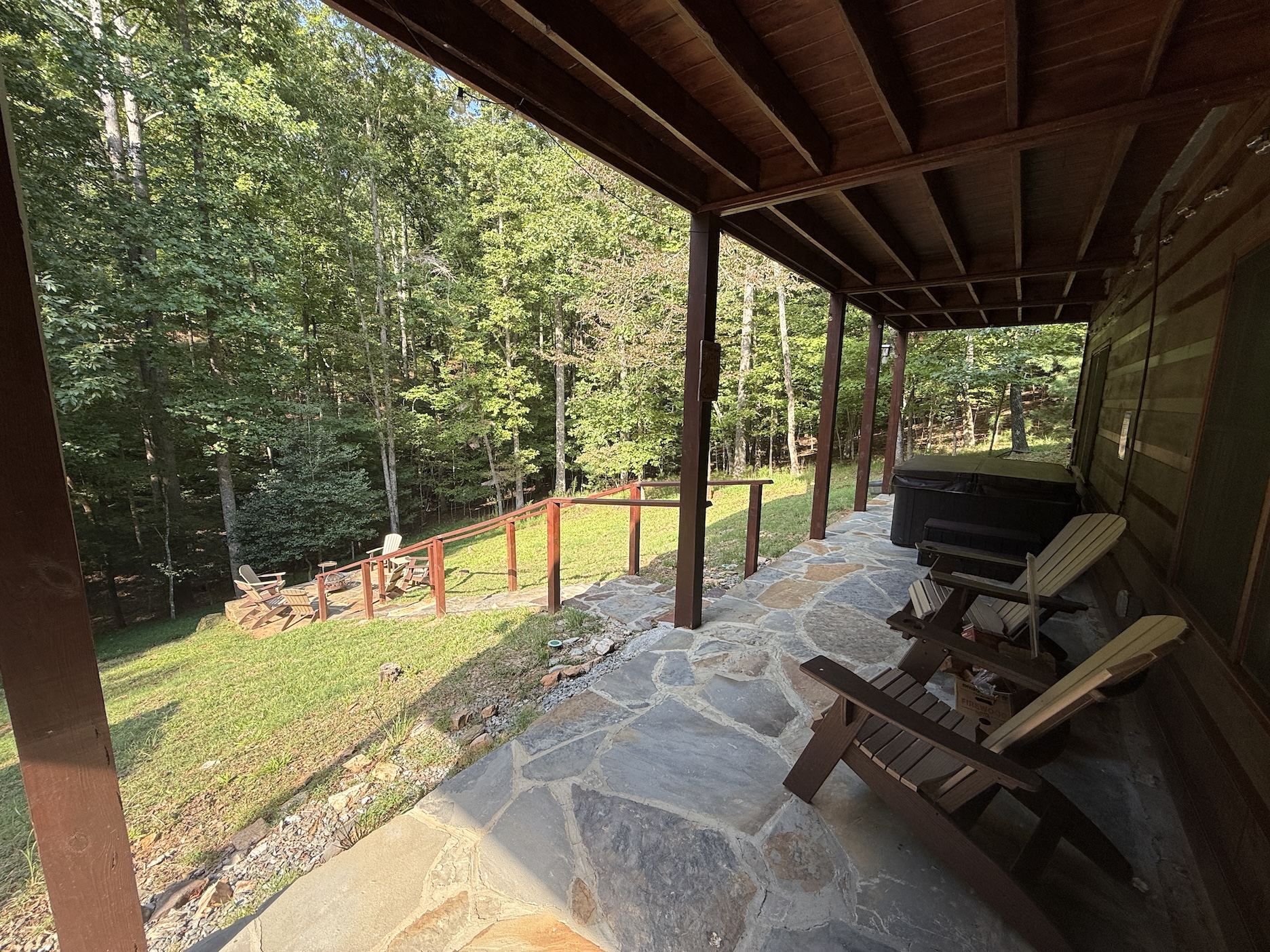 Private hot tub and stairs down to firepit. This area will be fenced in shortly to allow the fur babies to spend time with their family at all times!