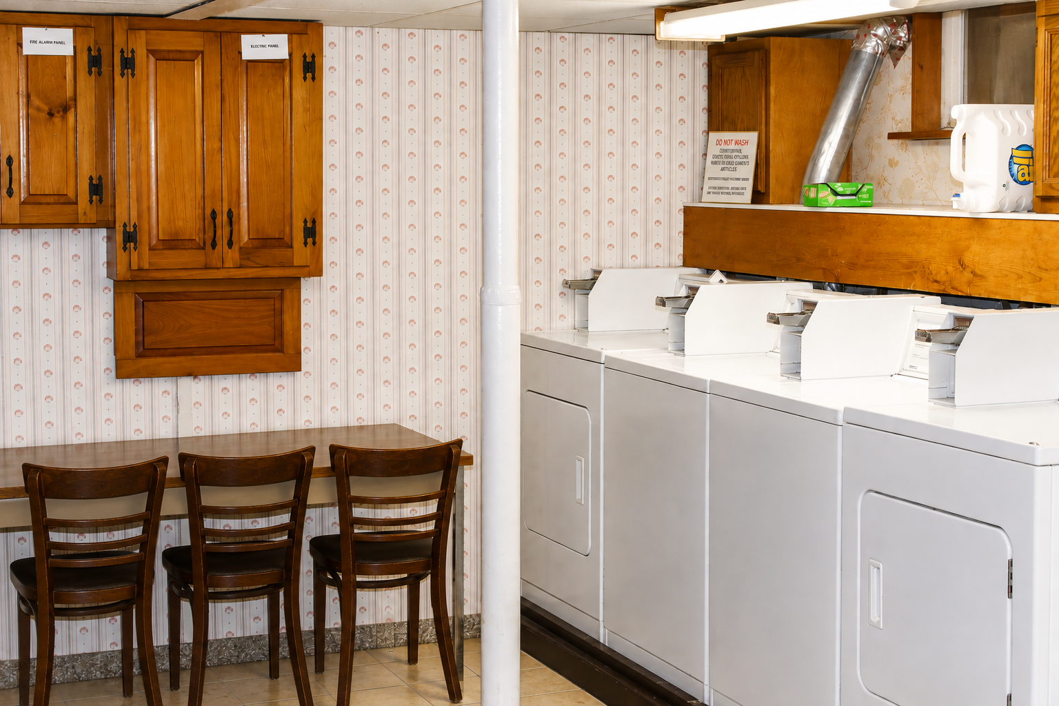 Shared laundry room with multiple washers and dryers - no waiting!