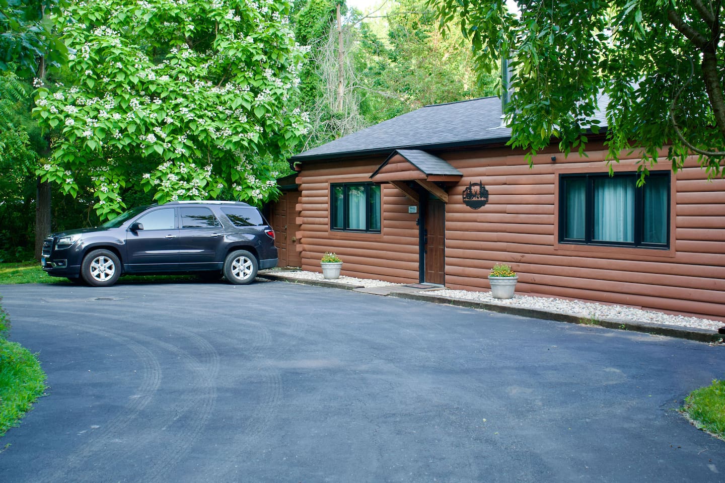 There is space to park 2 vehicles in front of the Guest Quarters. You can back one car in as shown and park another parallel to the house. For safety reasons, we ask guests not to block the circular driveway. There is no street parking. 
