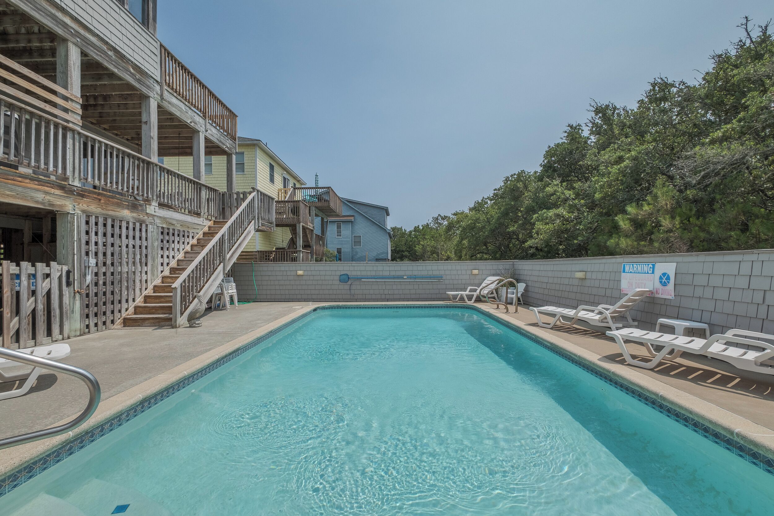 Soak up the sun by the pool with plenty of seating