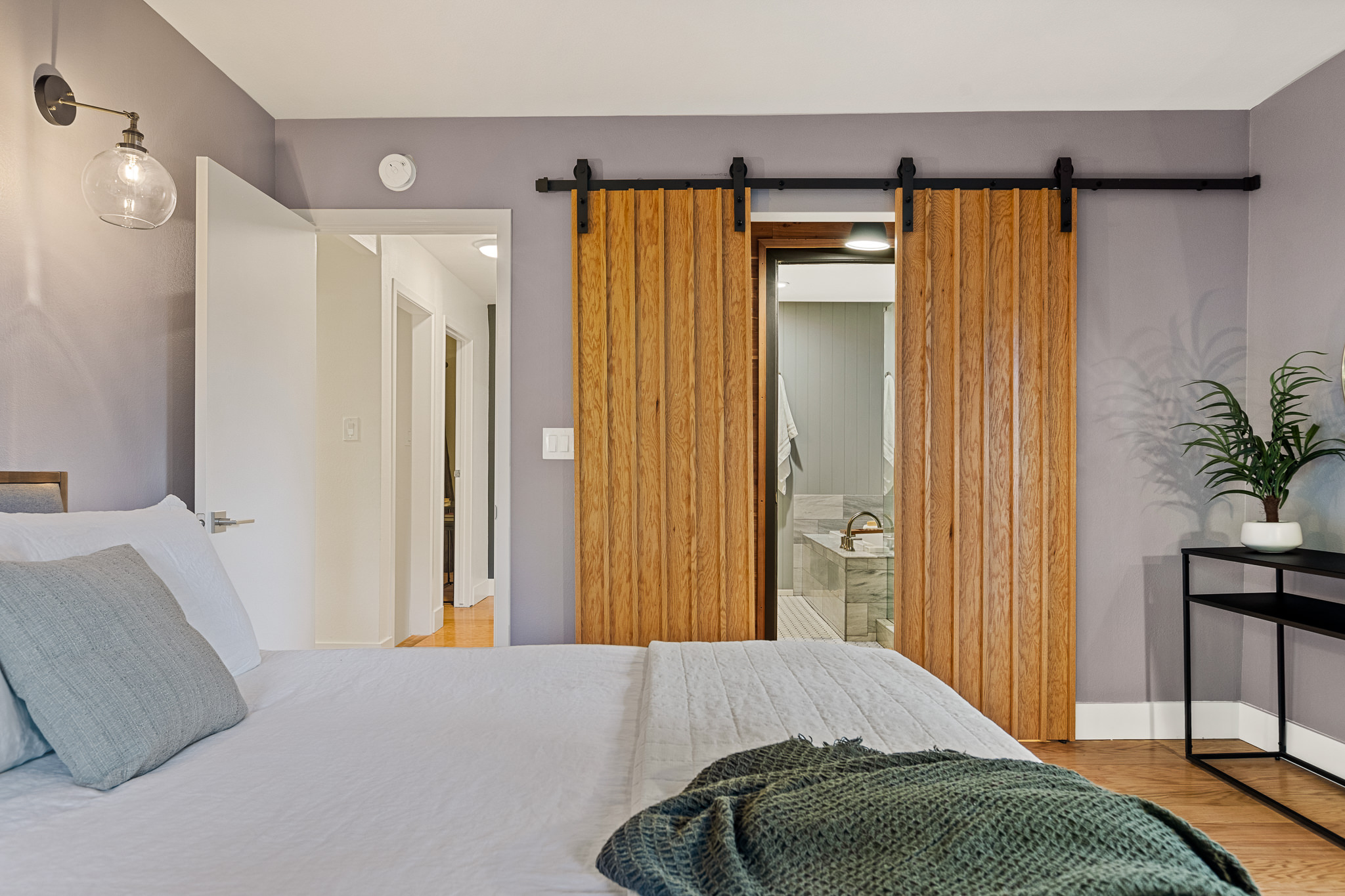 Bedroom 2: Enjoy a peaceful night sleep surrounded by the trees and clear mountain skies. (Queen Bed)