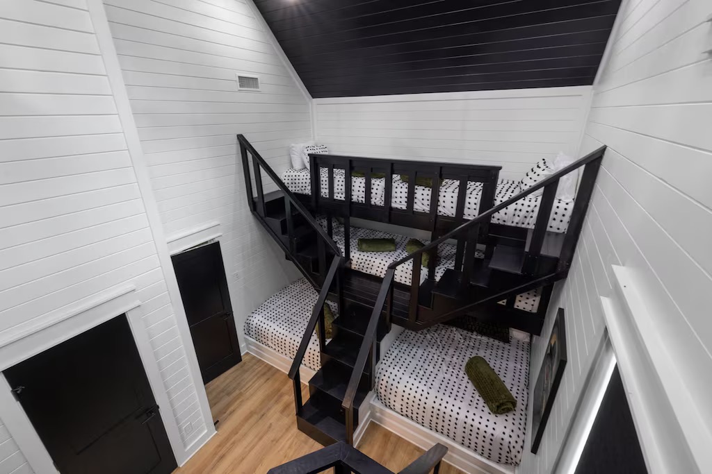 Bunk Room: Fun sleeping quarters with unique stairs and playful polka dot decor await your adventure!