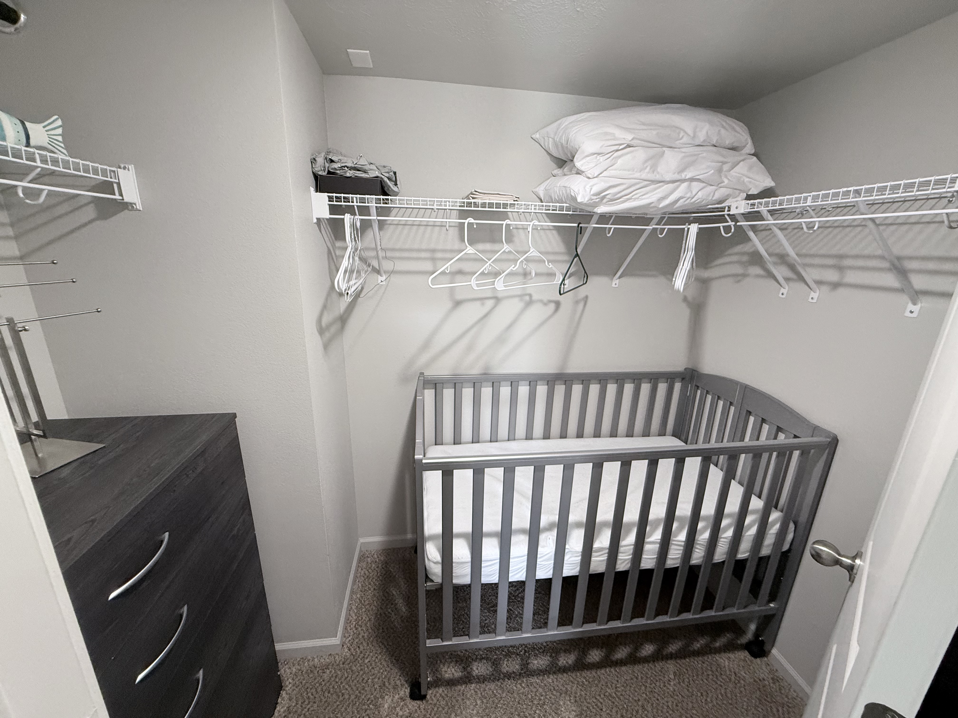 crib is stored in closet. can be rolled into bedroom
