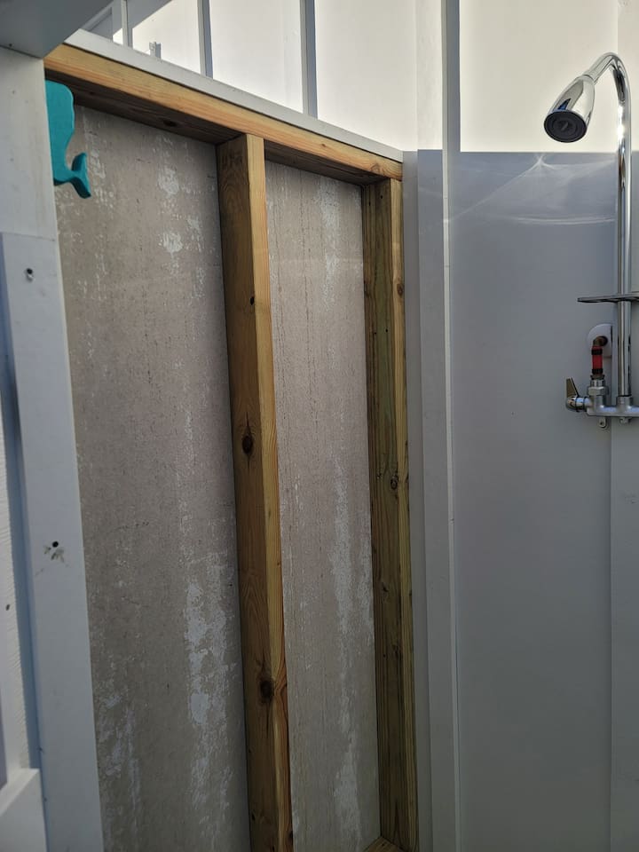 Outdoor shower perfect for rinsing off that sand from the beach.   