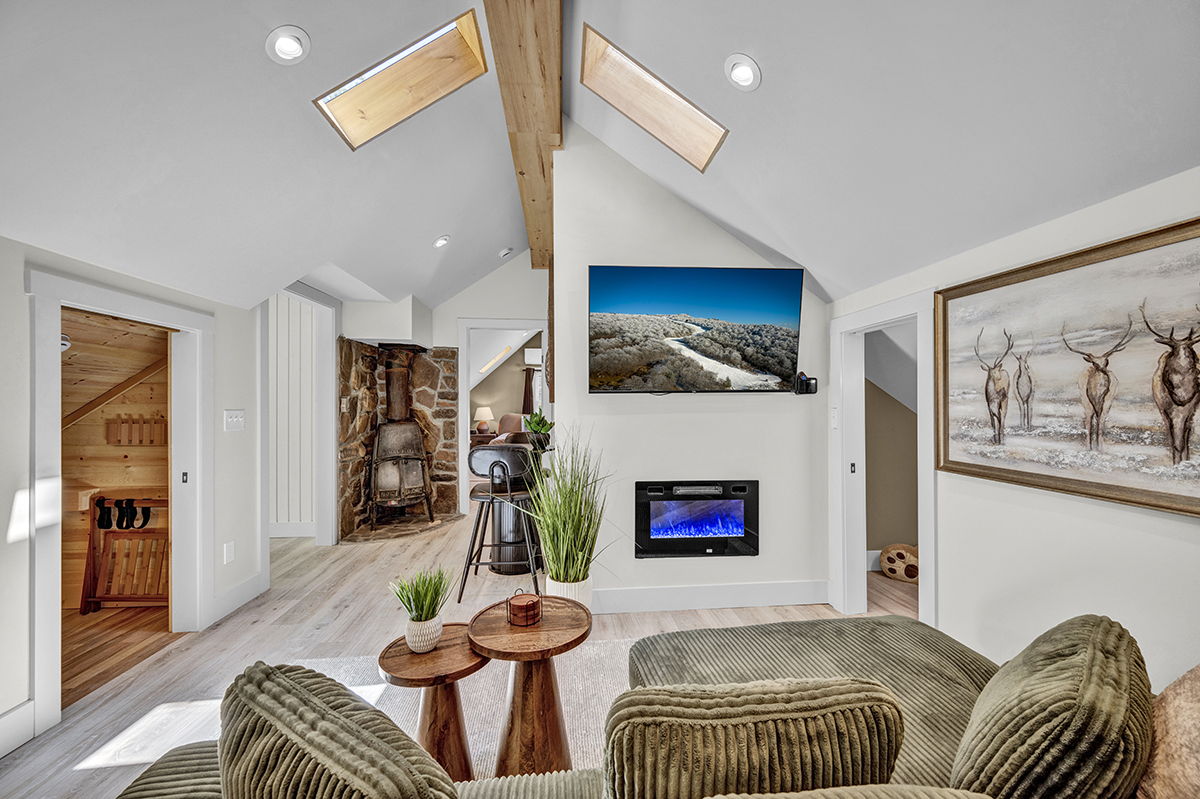 Cozy Living Room with 55-inch Smart TV, Fireplace, and bistro table.