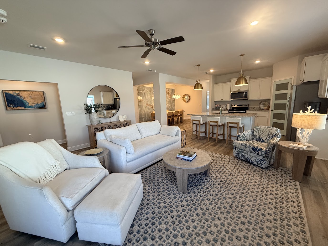 Bright, open-concept space connecting living, dining, and kitchen for seamless group gatherings.