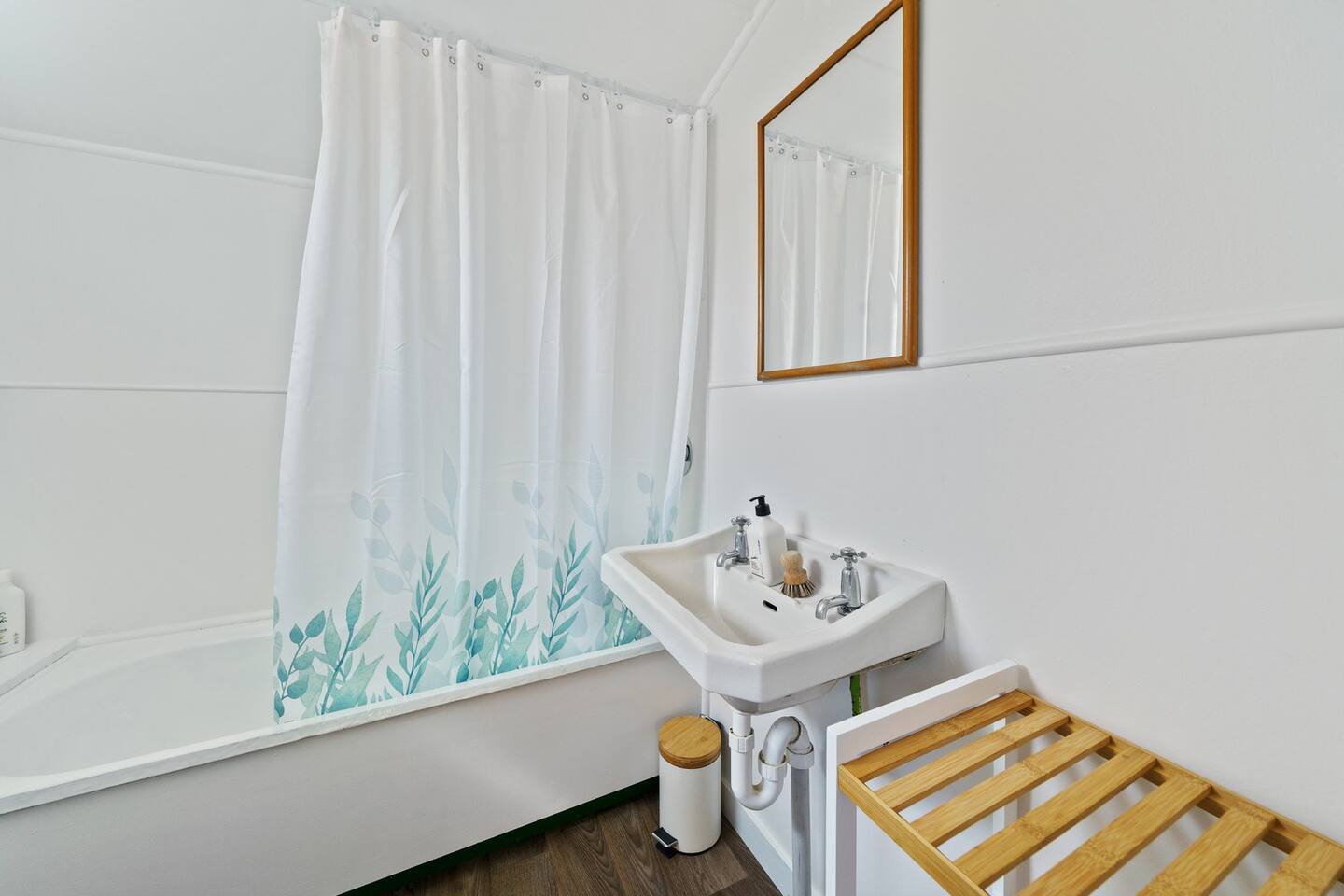 A nice big bath for a good soak after a long day at the beach.  

The bathroom consits of,  shower over the bath, basin and storage cupboard.  There is a seperate toilet down the hall.