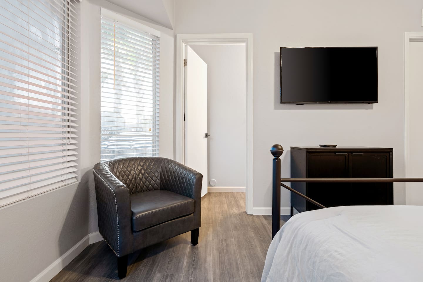 There's plenty of space in the main bedroom, including a sitting area and TV