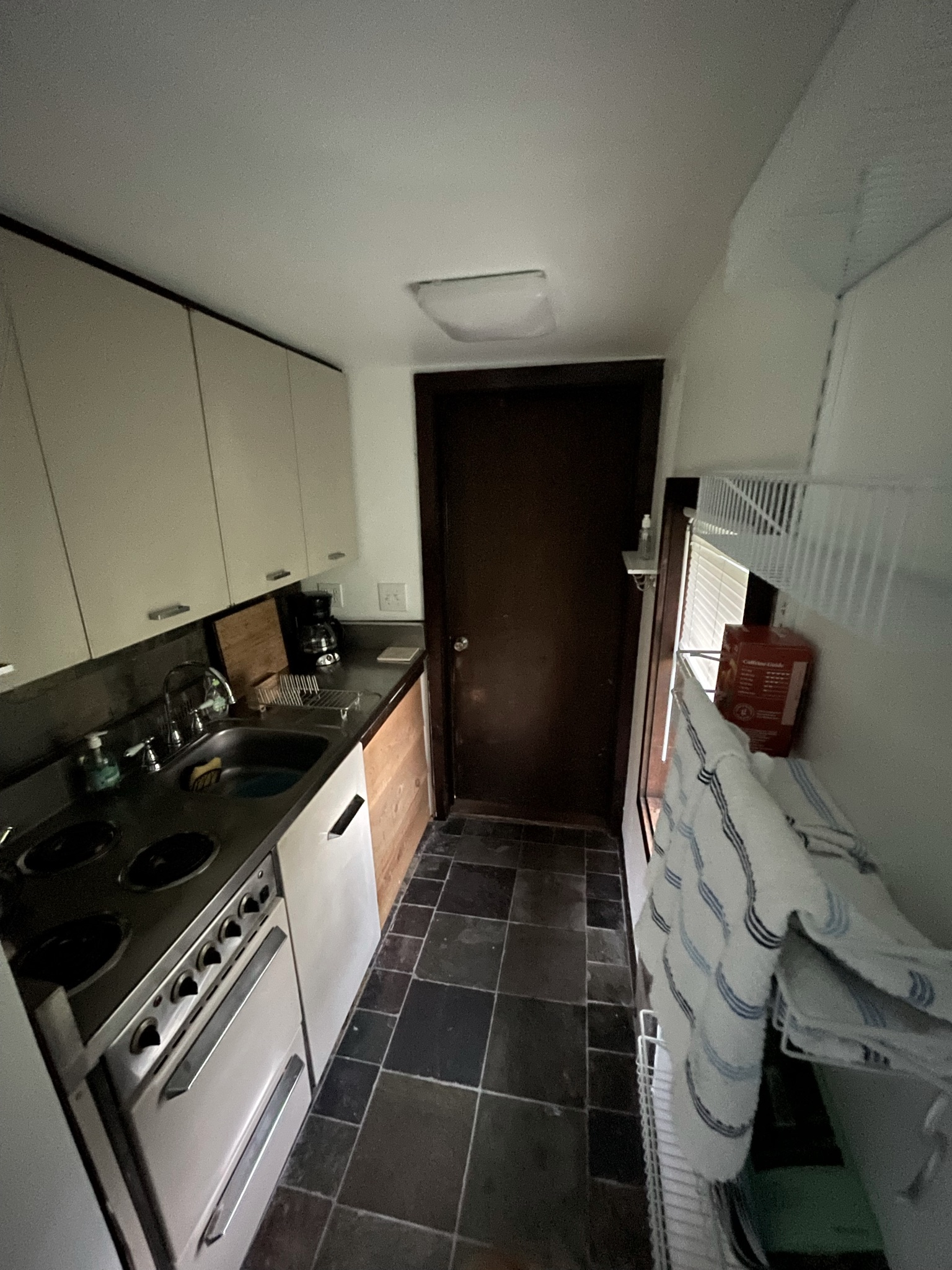Kitchenette in one bedroom apartment (full-size fridge just outside the door to barn)