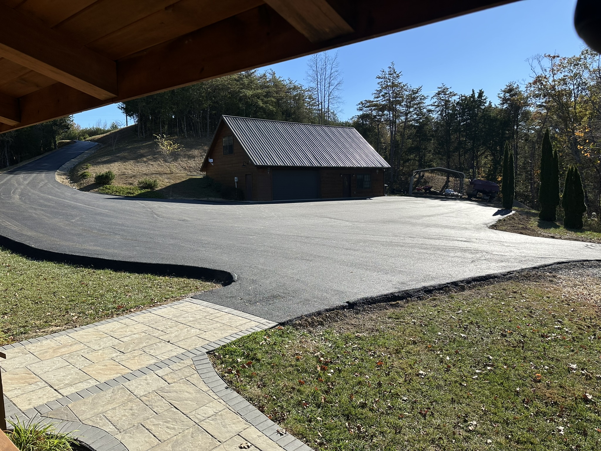 Very large paved parking lot and nice walkways from parking lot front of cabin and around the side of the cabin to the back patios.
