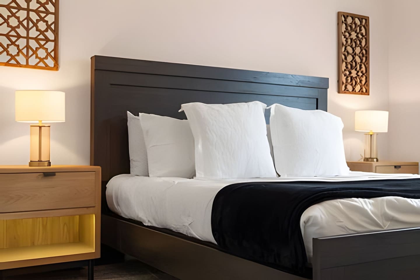 Wake up to natural light and relax in a serene bedroom, designed for comfort and relaxation.