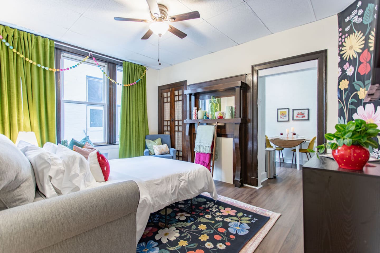 Bright and spacious living room featuring a comfortable sofa bed, perfect for relaxing or accommodating extra guests.