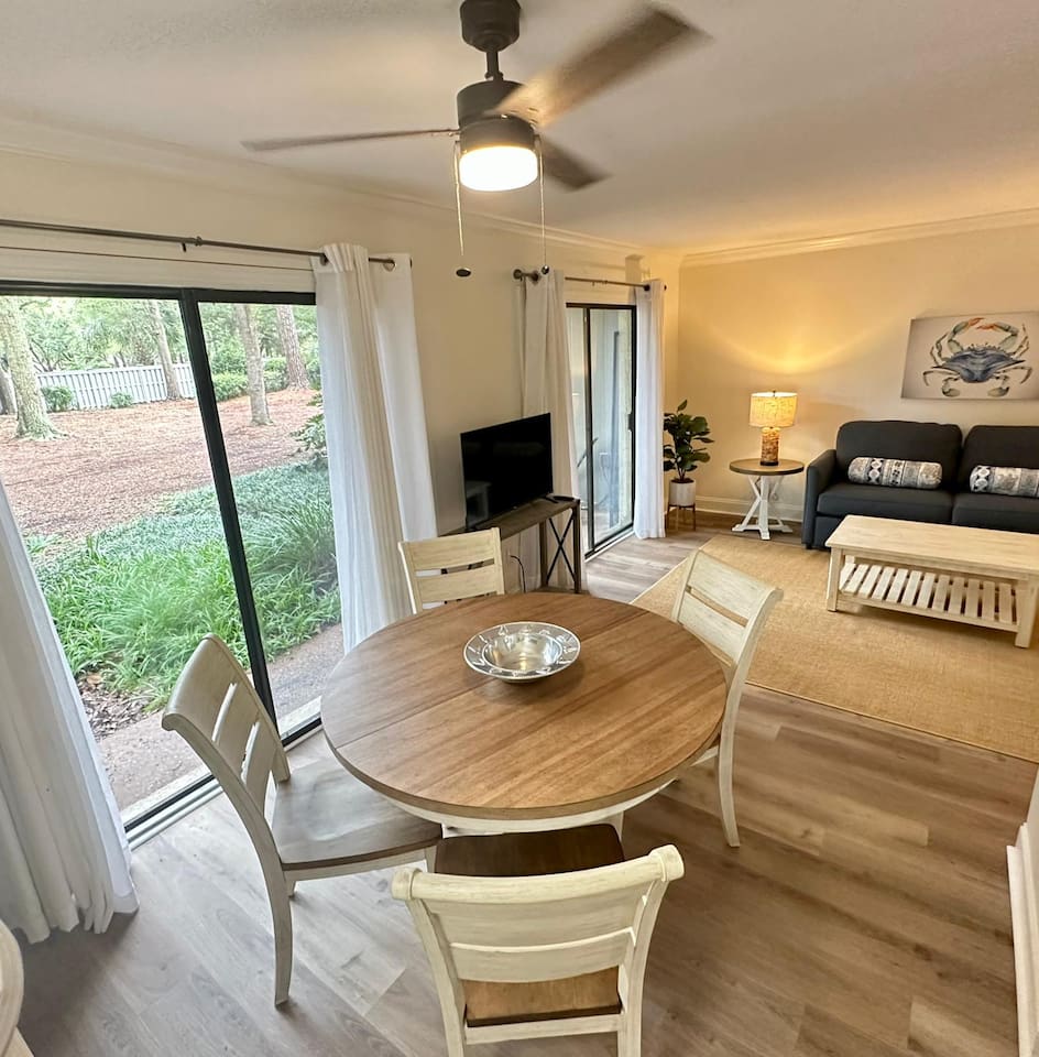 Round dining table by the patio doors