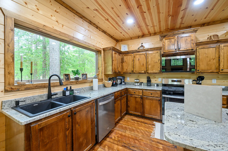 Rustic kitchen with warm wood finishes and cozy cabin atmosphere