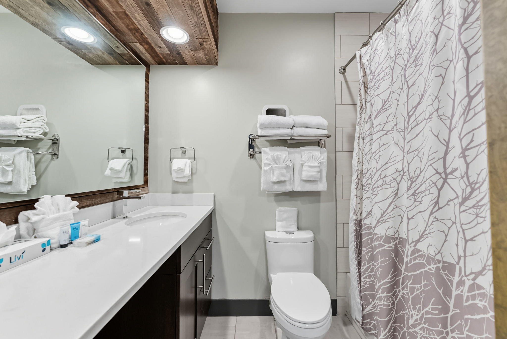 Full bathroom with two sinks, tub/shower