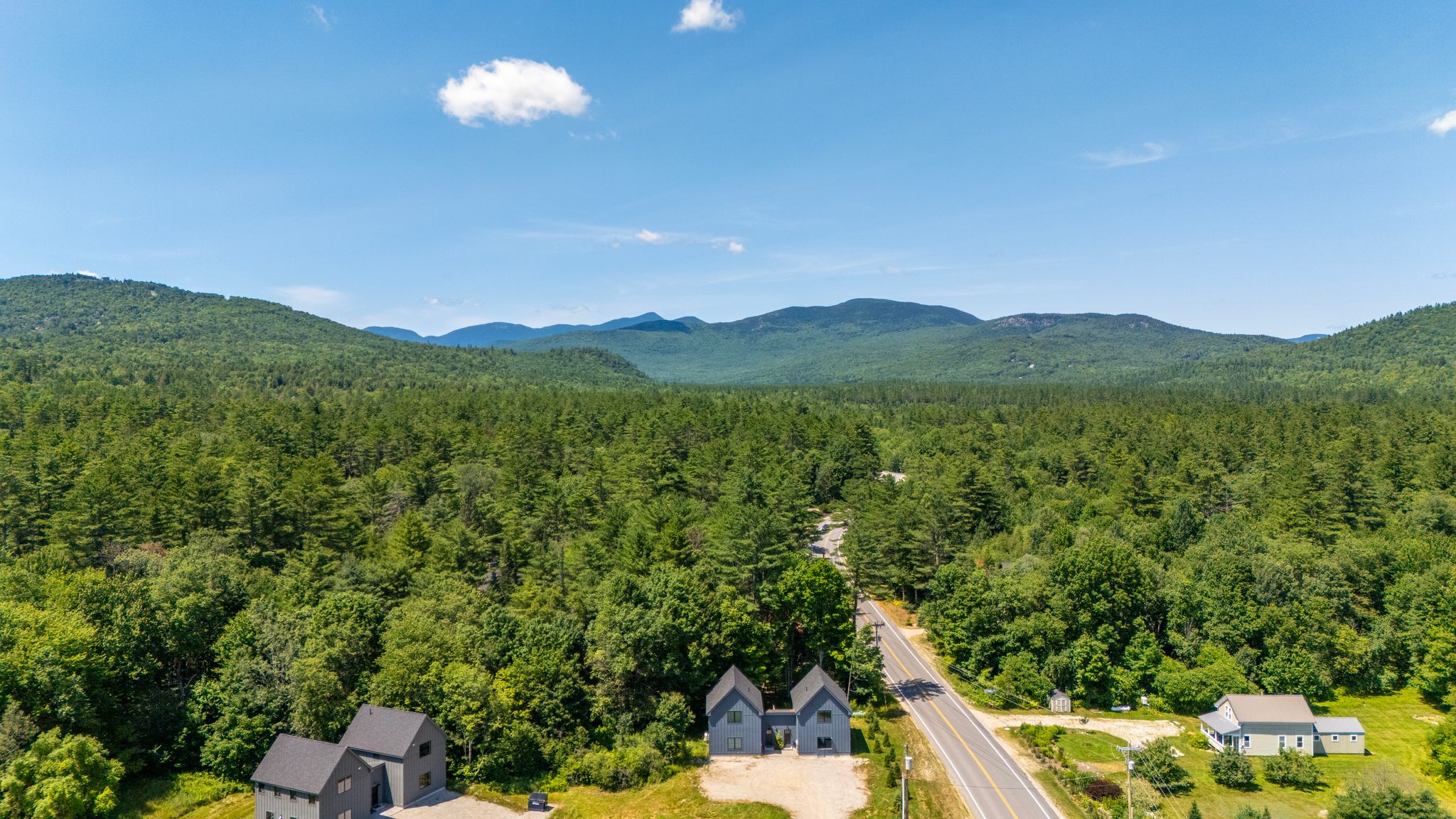 Beautiful panoramic views showcase the peaceful natural surroundings and nearby mountains.