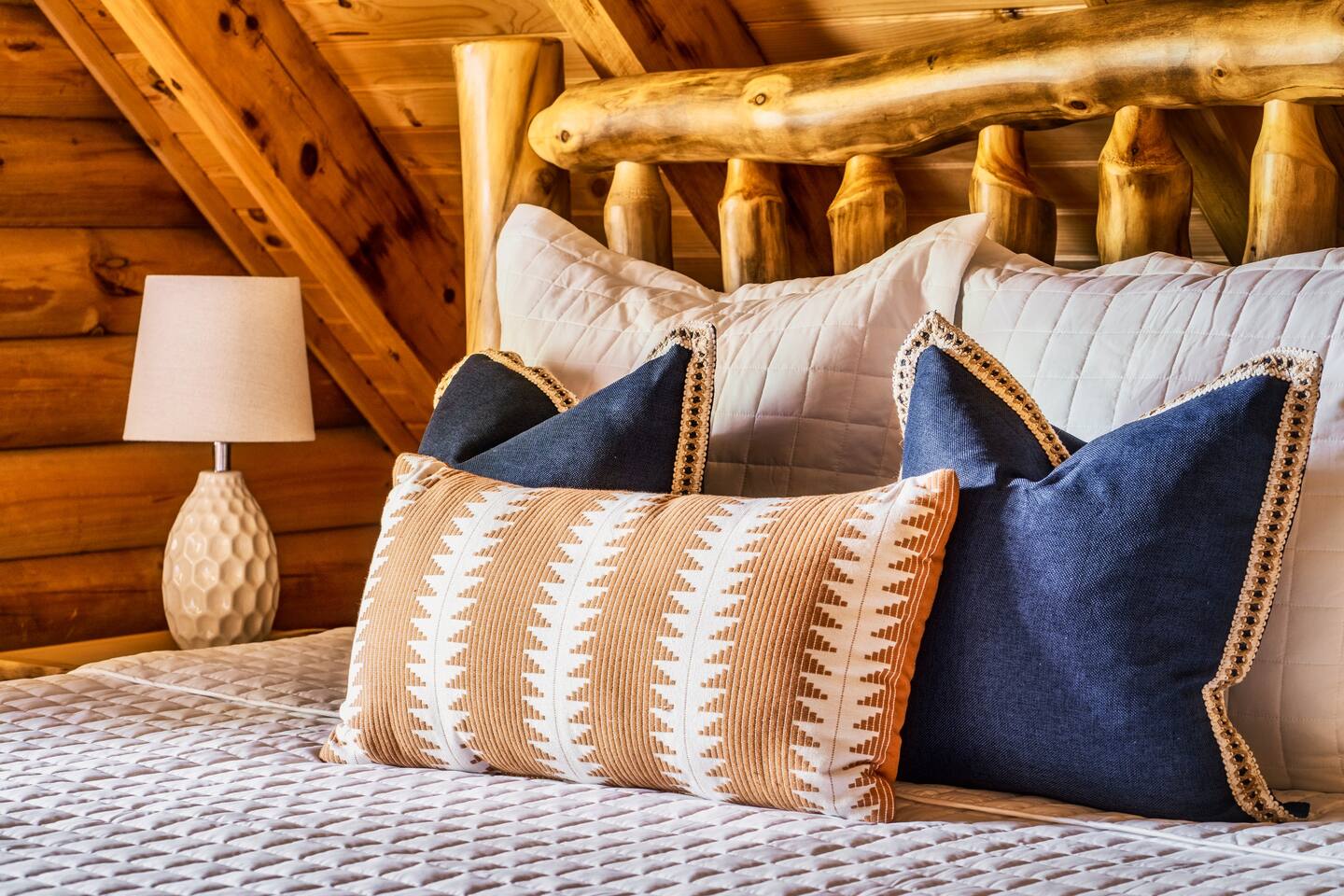 Plush bedding and beautifully make log beds