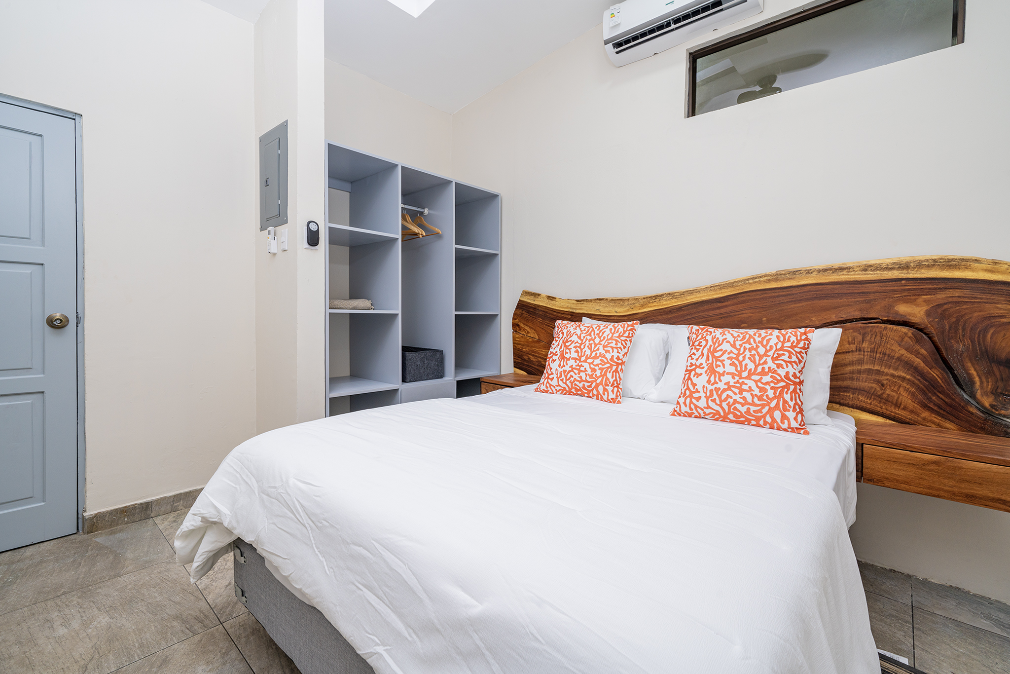 The guest bedroom has a queen bed and ample closet space, air conditioning & ceiling fan