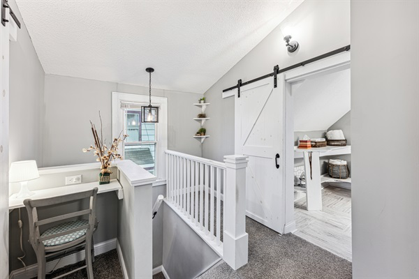 Upstairs common area with cozy little desk and workspace