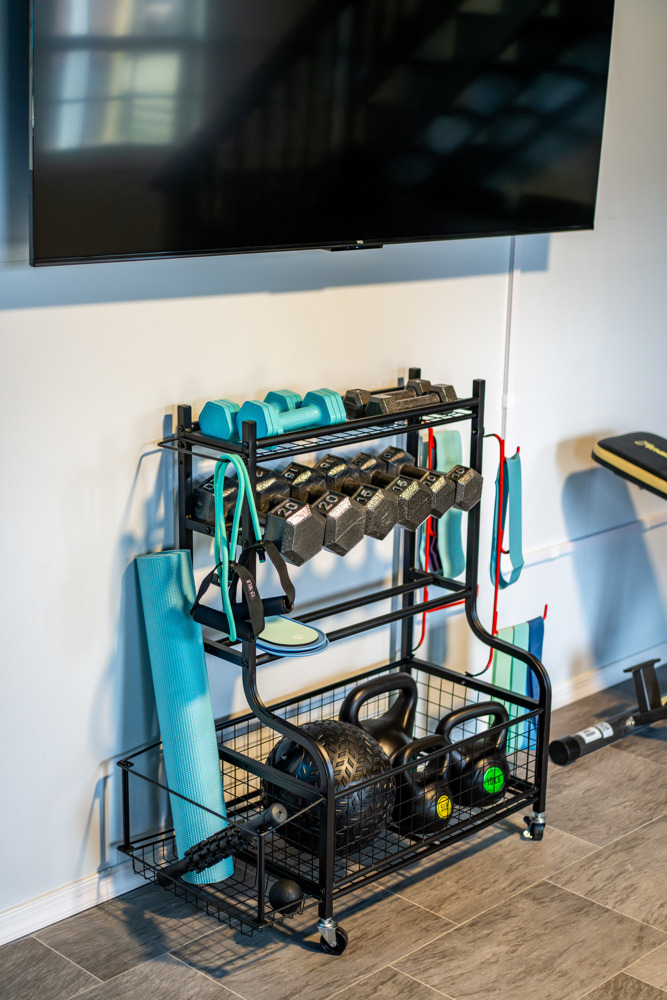 Fitness-friendly amenities including dumbbells, kettlebells, and workout gear for strength training anytime.