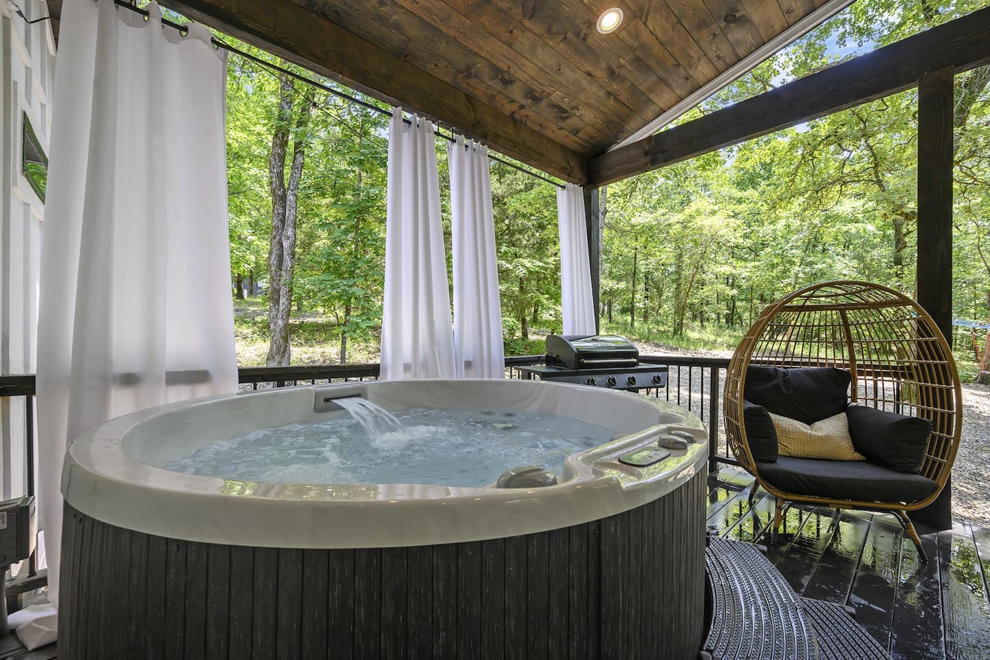 Unwind in your private hot tub surrounded by lush trees and nature's beauty!