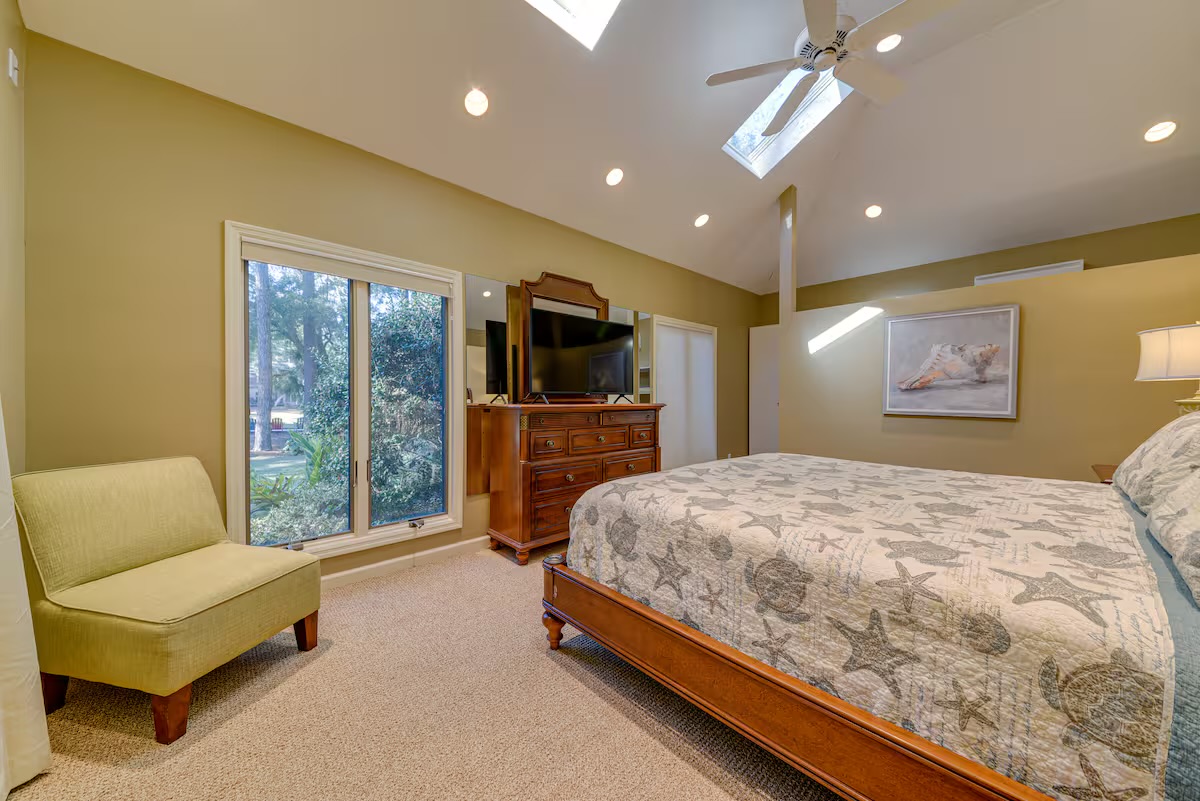 Primary Bedroom features a king bed and 55" HDTV