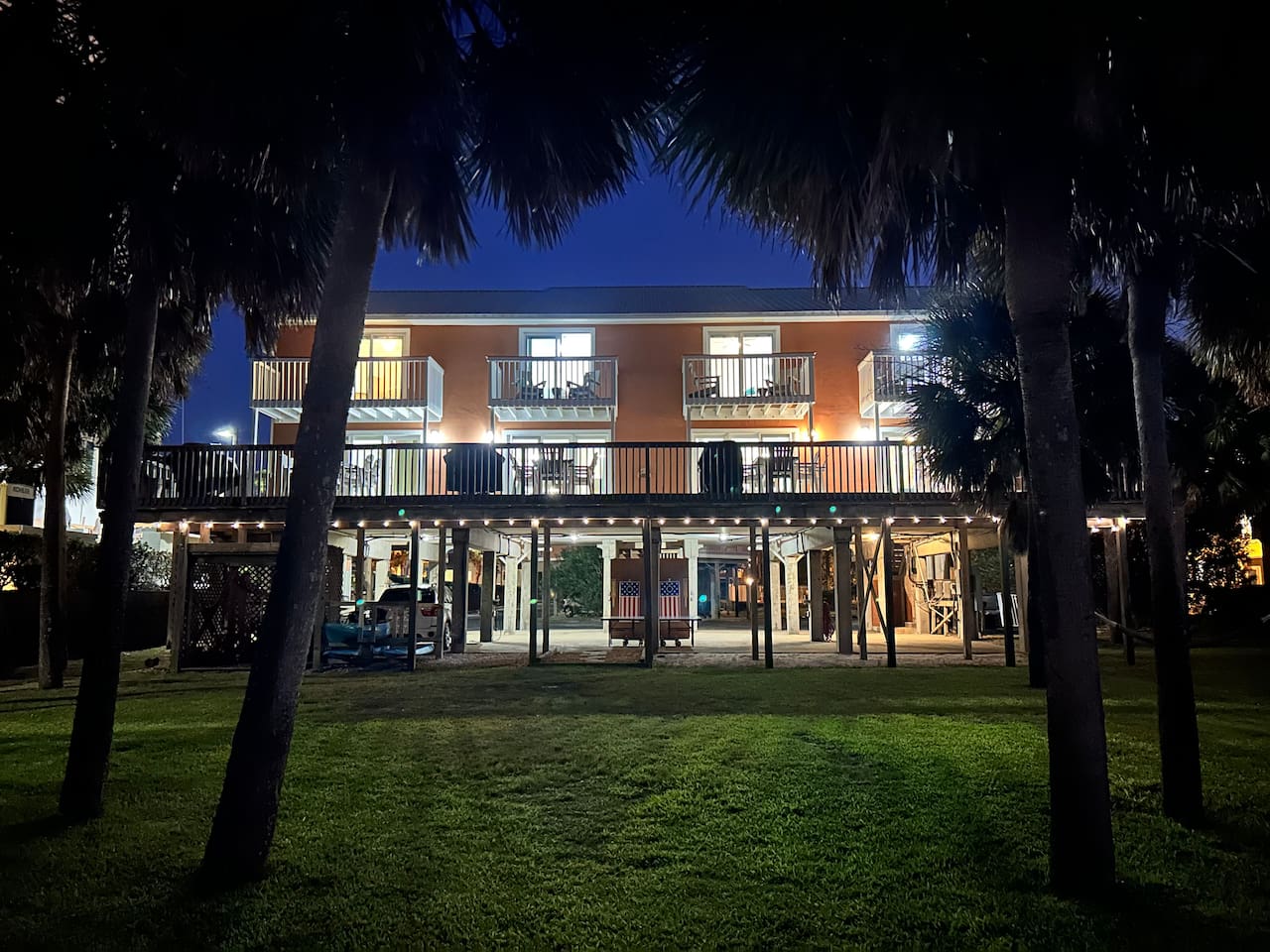 Cozy “Just Beachy” getaway with tropical vibes and glowing evening ambiance in Gulf Shores, AL.