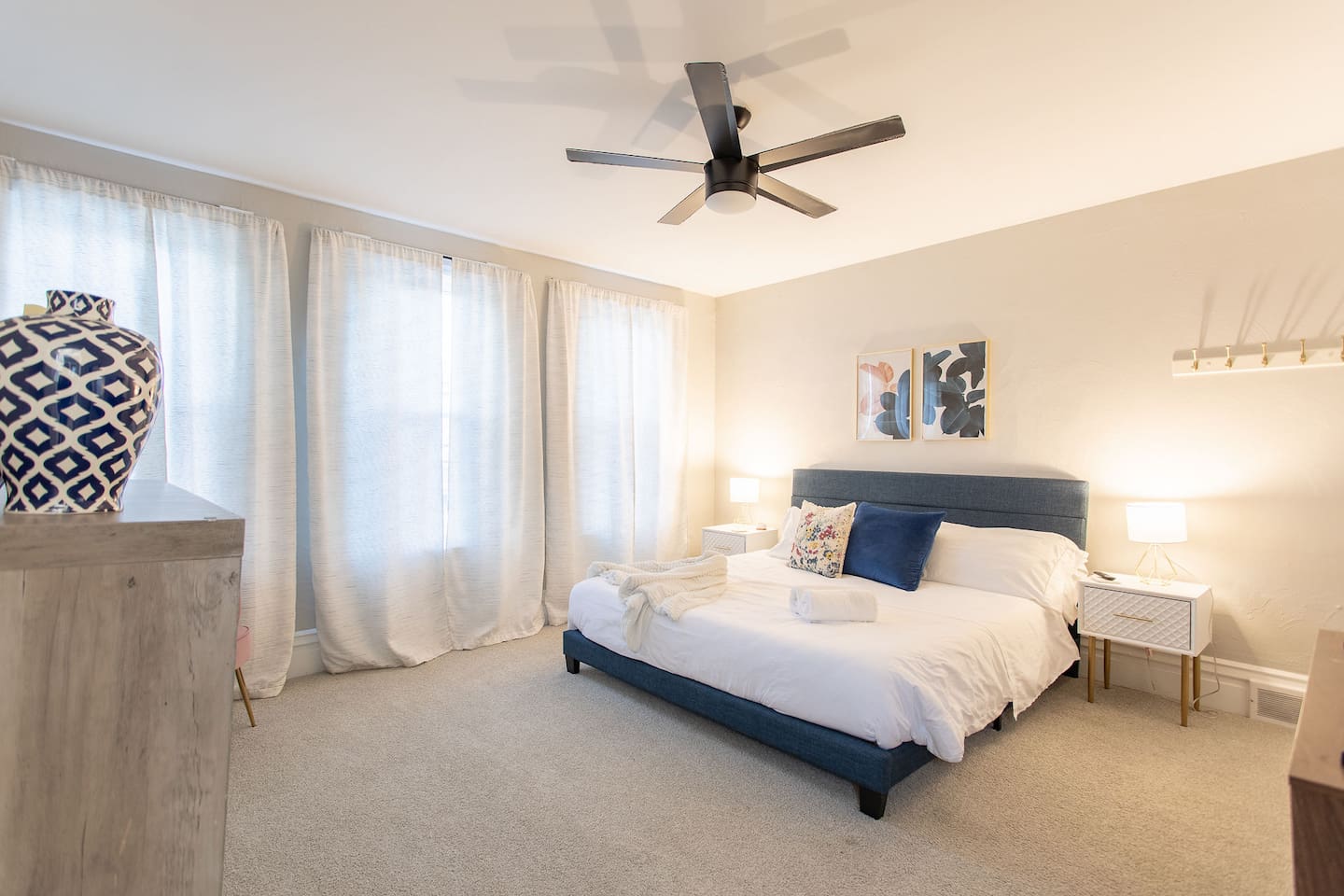 Discover the King Bedroom, a spacious room on the second floor with king bed flanked by nightstands with lamps.