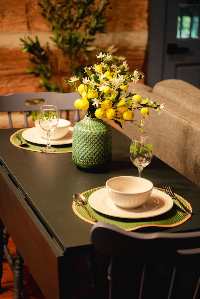 Set the table with a cozy setup and fresh flowers – perfect for a quiet meal.