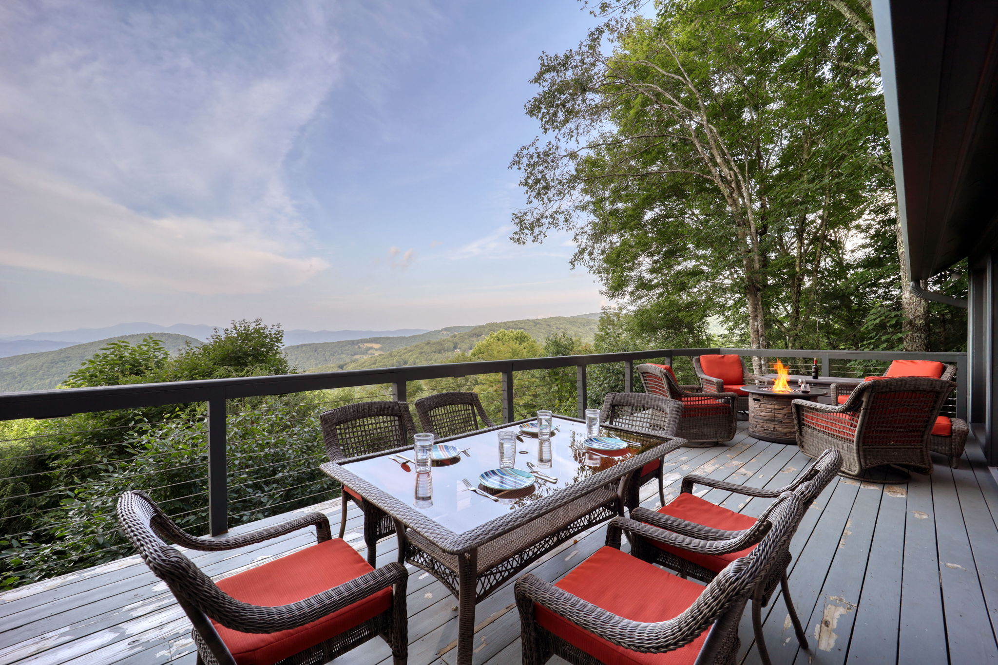 Plenty of seating on the deck to soak in the views.  Cushions are all stored in closed containers so they will be dry and ready for use!