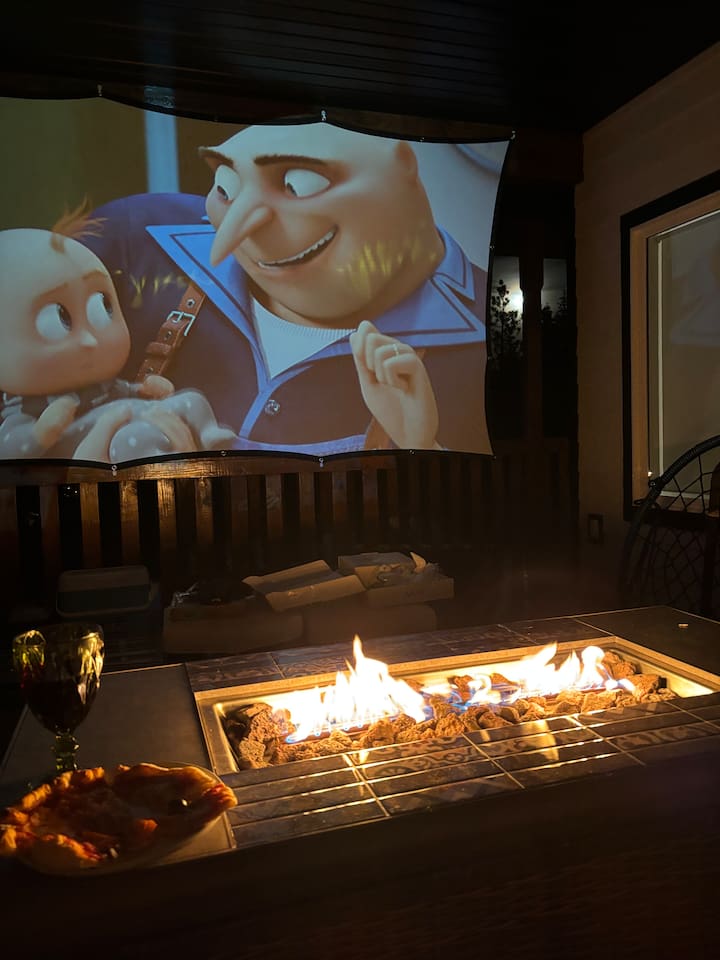 Enjoy a movie by the fire on our outdoor projector 