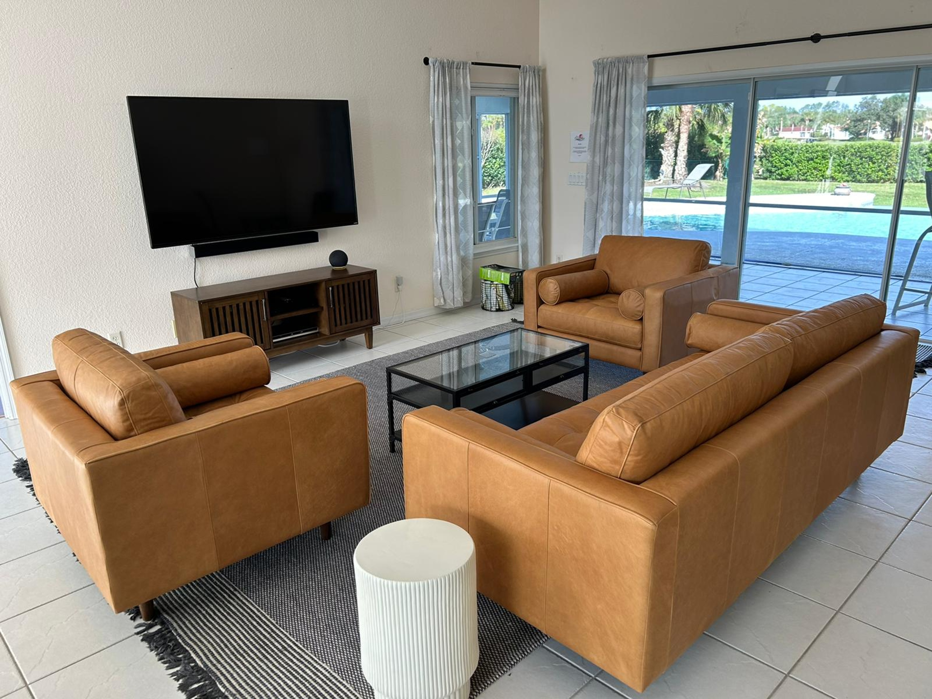 Living Room and smart TV, view of pool and backyard