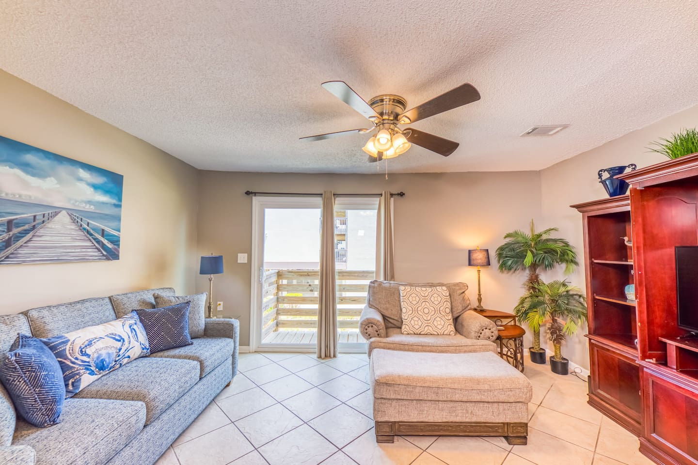 Living Room: Bright space with stylish seating & balcony access, perfect for relaxation and fun!