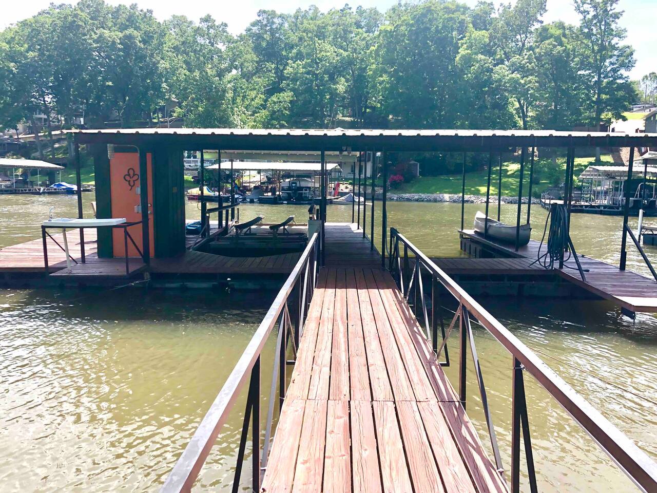 Two boat slips, one with 6000# lift for Vhaul boat and other open, fish cleaning station, table and chairs, plus more!