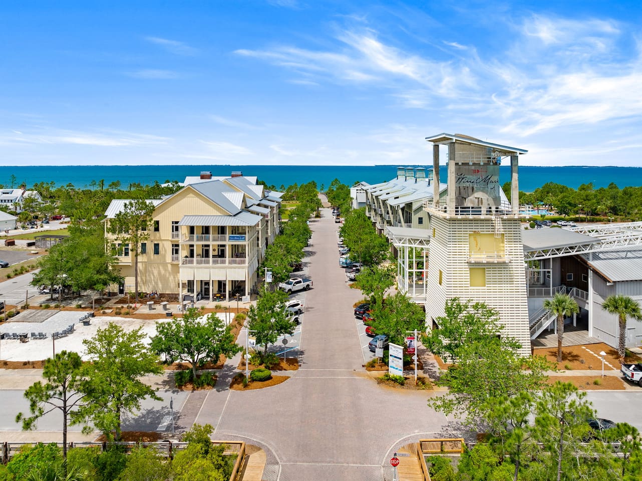 Community Town Center with dining, beach access, community pool, live entertainment, cafe, and candy shop | 6 min walk from home
