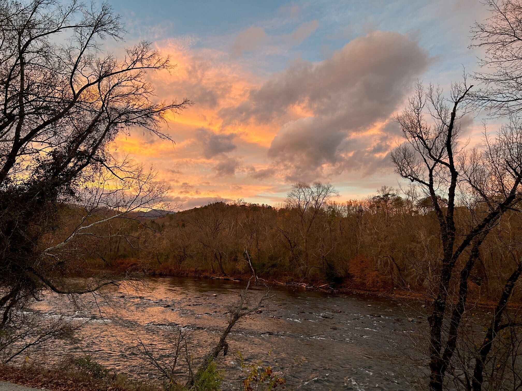 The sunrise over the river create amazing colors that are reflected on the water