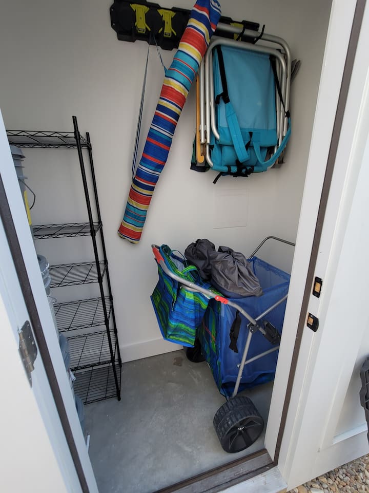 Chairs, cart, umbrella and additional beach gear storage for your use!