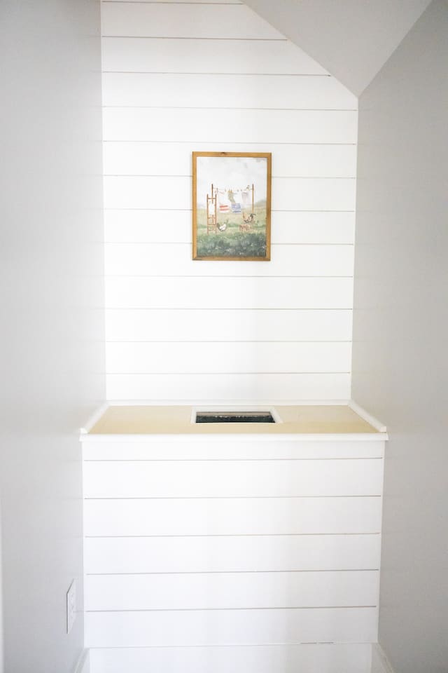 A laundry chute is available off the second floor balcony and leads directly to a giant rolling hamper in the laundry room.