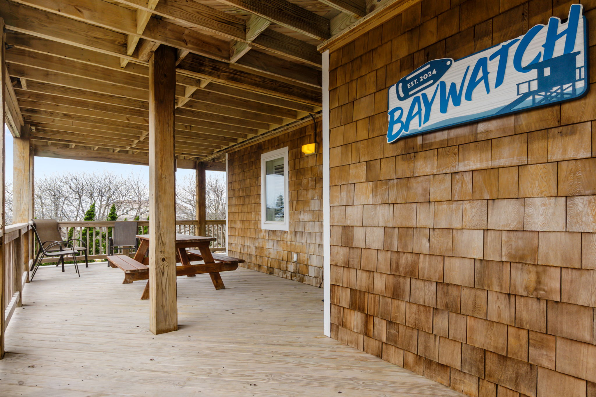 Covered outdoor space with seating and a casual hangout area.
