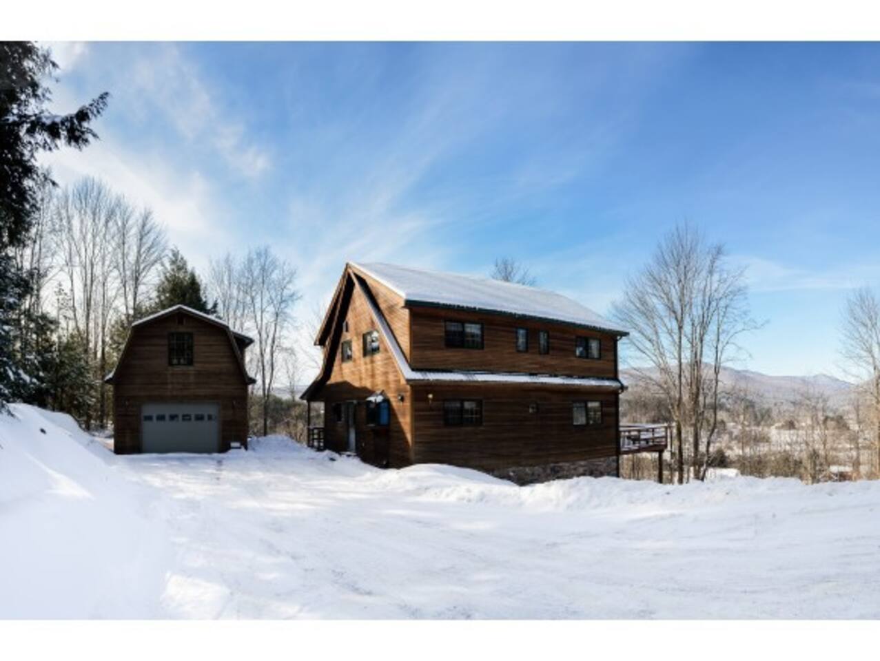 The house and garage in the snow