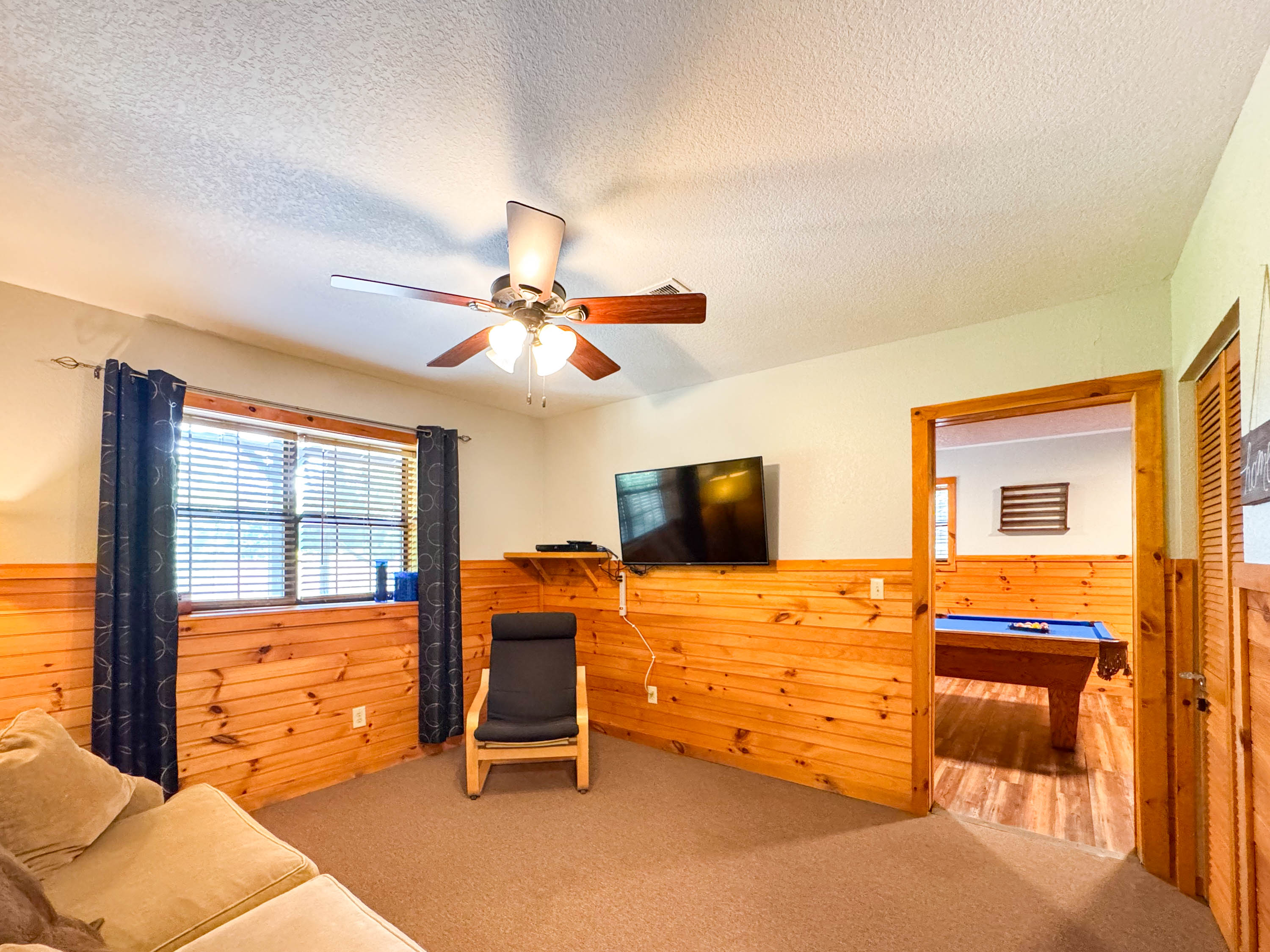 lower level game room sitting area. Smart TV