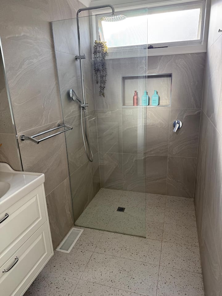 The smaller bathroom has a shower (2nd toilet) and single vanity. This one has central heating/cooling (the other one has a wall heater only). Also, fully stocked as you'd expect. Guests love the high-pressure shower.